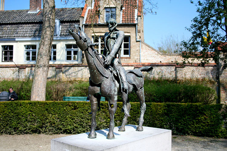 One of the Four Horsemen of the Apocalypse bronze sculptures by artist Rik Poot in Bruges, Belgium