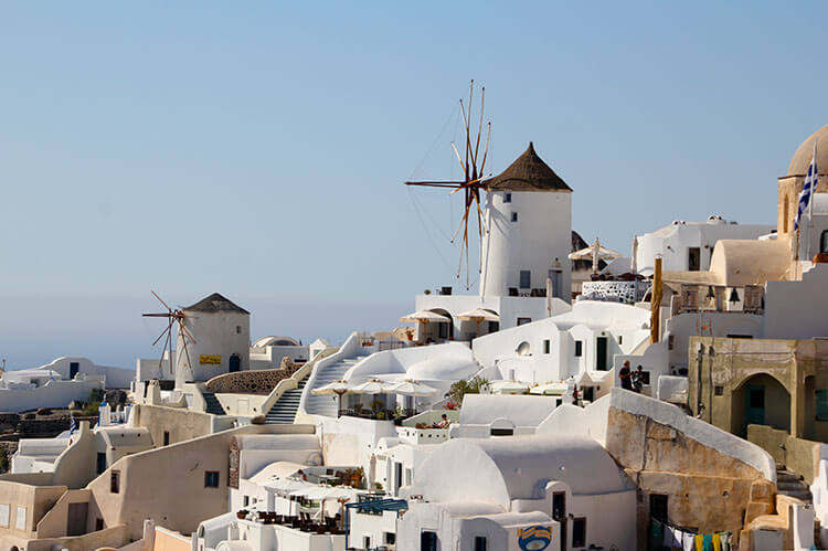 The windmills and white washed houses of Oia, Santorini