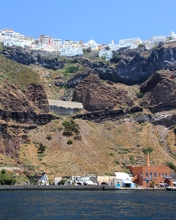 View of the port and cable car to Fira from a cruise ship in Santorini