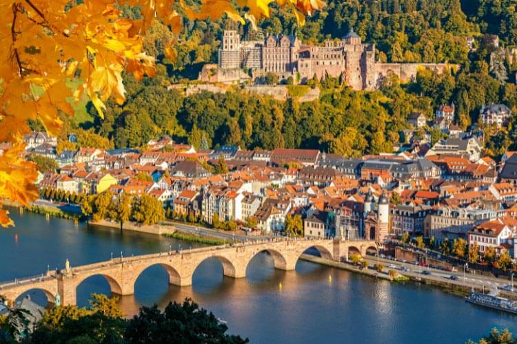 A view over Heidelberg, Germany with the Old Bridge leading to the medieval gate and the castle situated above the town