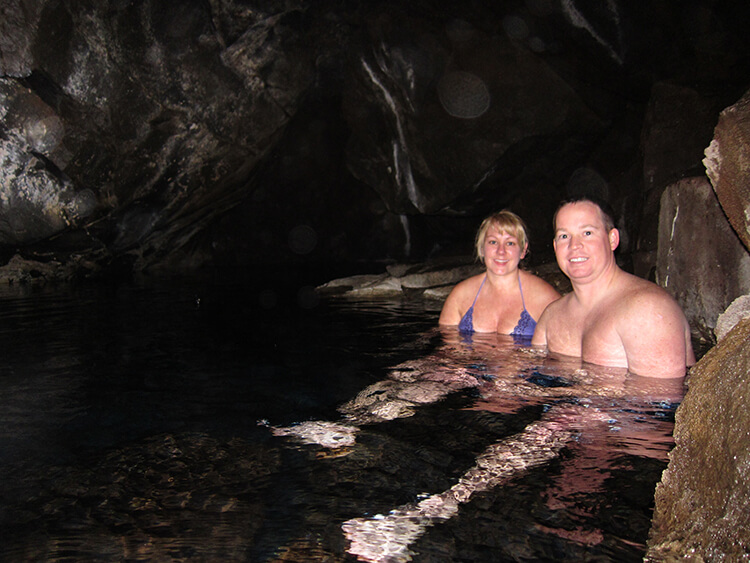 Bathing at Grjótagjá Thermal Spring - Luxe Adventure Traveler