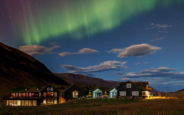 The Northern Lights dance over Deplar Farm in North Iceland