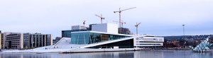 A panorama from the side of Oslo Opera House showing the sloping roof that you can walk up on top of