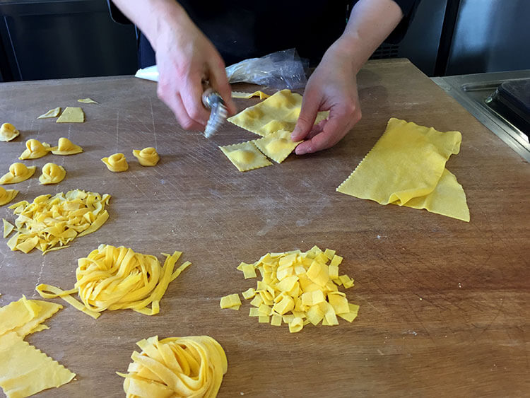 A workspace with various kinds of pasta we learned to make in a cooking class