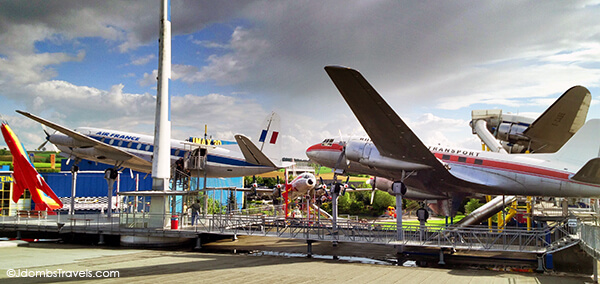 Kids play area equipped with multiple planes that have giant slides you can shoot down from