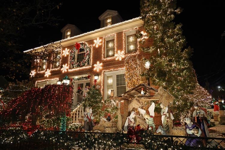 A life-size nativity with Mary, Joseph, baby Jesus, the three Wisemen and animals decorates the lawn of a Dyker Heights house in Brooklyn