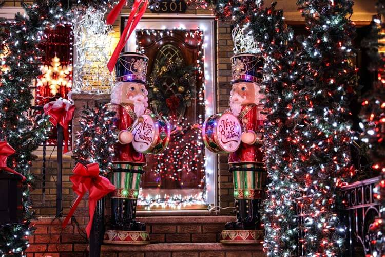 Two toy soldiers beat drums choreographed to music at a house in Dyker Heights, Brooklyn 