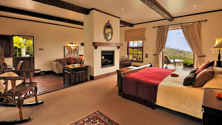 The cottage suites with a dual-sided fireplace dividing the bedroom from the sitting area