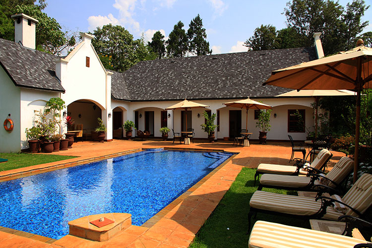 The pool and building that houses the spa at The Manor at Ngorongoro