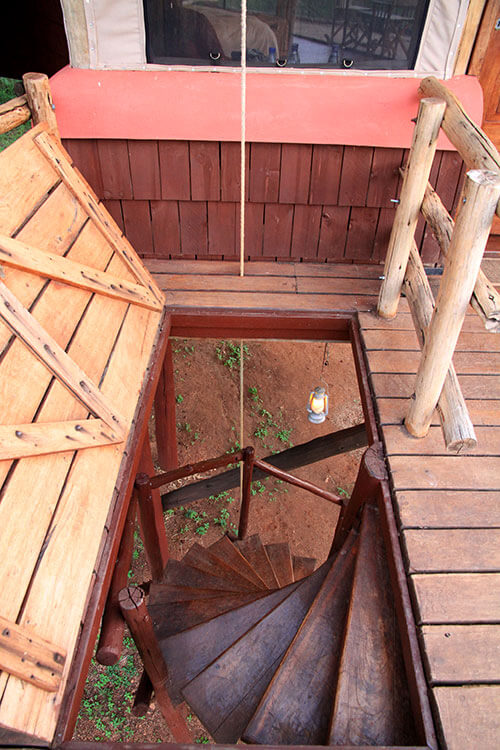 The trap down and spiral staircase to access the tree houses at Tarangire Treetops