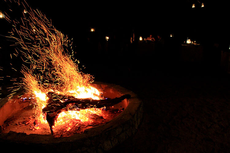 A fire in the firepit of the boma at Tarangire Treetops