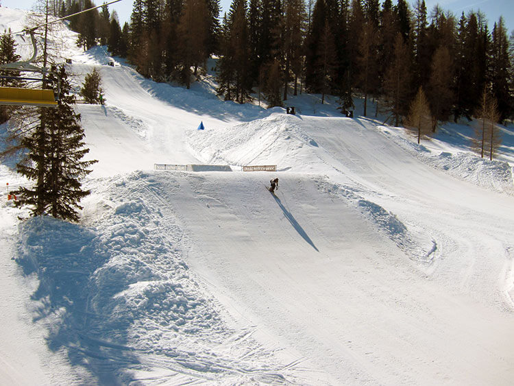 A skier tries a jump at the Snow Park at Alta Badia