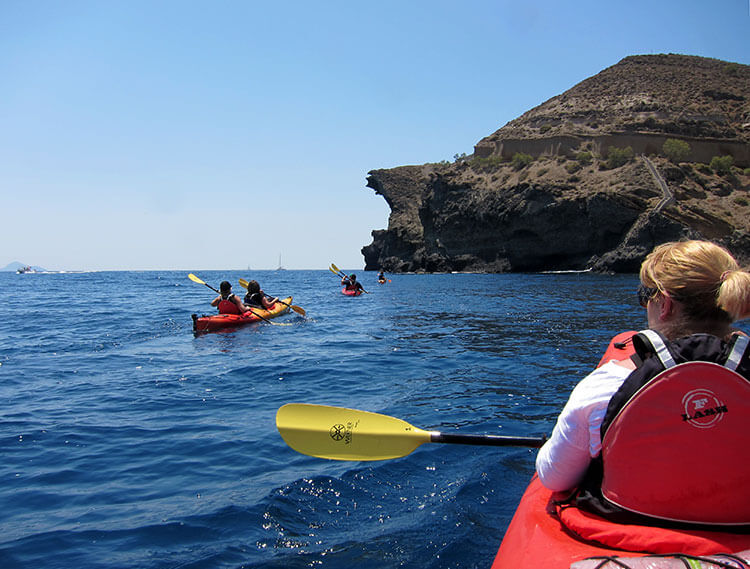 Kayaking along the coast in Santorini 