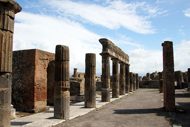 Columns lins the pedestrian street of the Forum in Pompeii