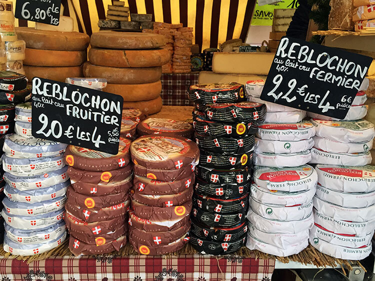 Reblochon cheese stacked up at the La Clusaz weekly market