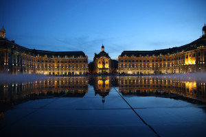 Place de la Bourse is reflected on the Water Mirror at blue hour