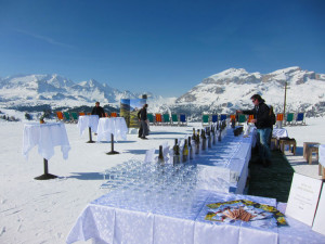 A table set up with wine glasses and bottles of Alto Adige wine for tasting on the Wine Ski Safari