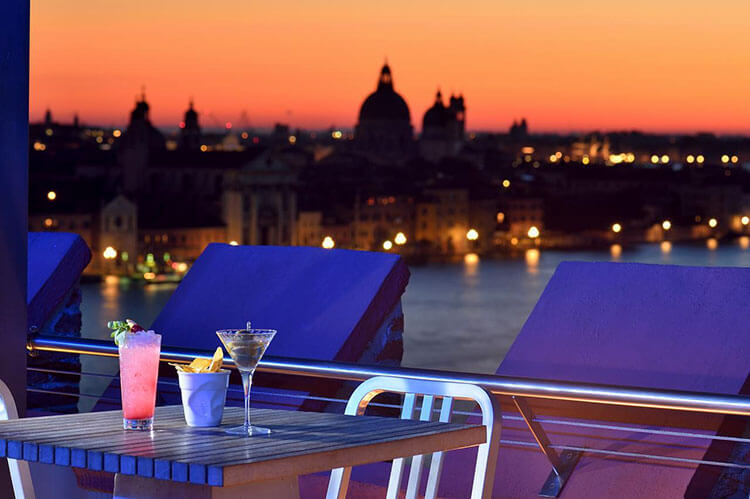 Sunset and Venice seen from the Sky Bar on the rooftop of the Molino Stucky