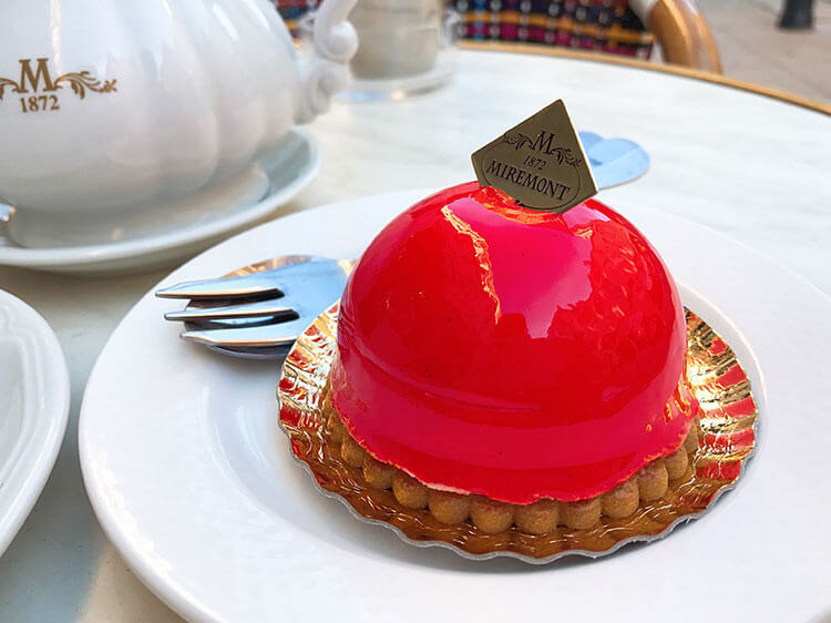 A raspberry and white chocolate pastry on a sweet biscuit at Patisserie Miremont