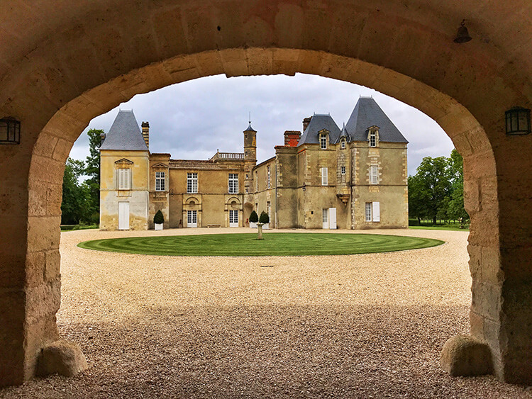 Chateau d'Issan as seen from the tunnel leading across the moat