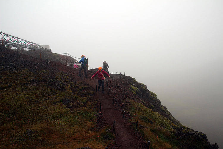 Climbing up to the opening on the volcano