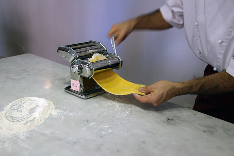 Rolling out dough with a pasta machine