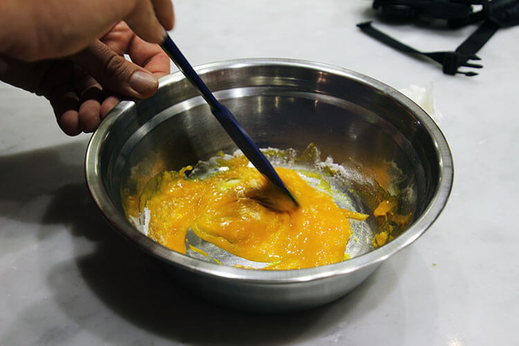 Mixing egg yolk and sugar