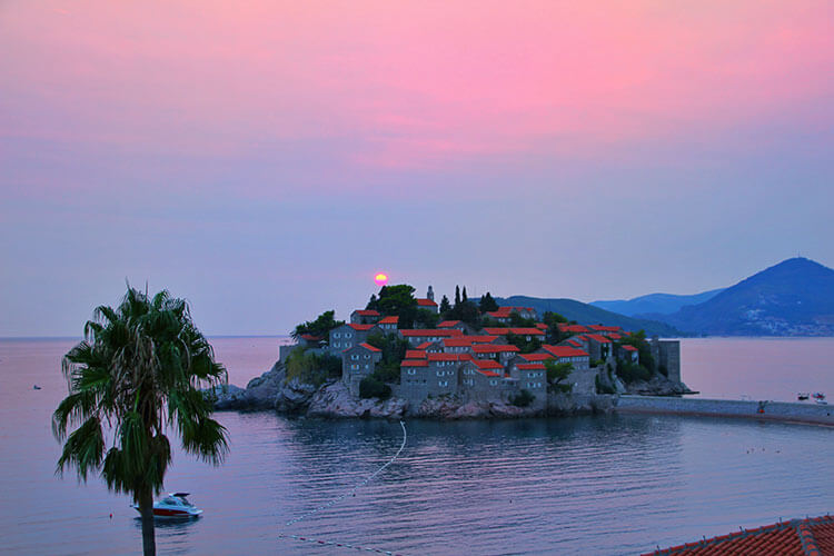 Sunset over the island of Sveti Stefan in Montenegro