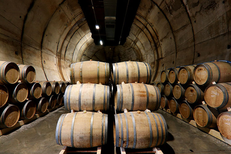 Wine barrels inside the diesel fuel bunker at Moon Harbour Distillery