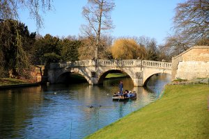 A punt glides down the River Cam behind King's College