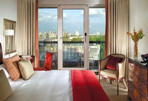 This bedroom in a serviced apartment in London has a river view