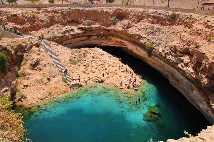 Bimmah Sinkhole seen from the rim with a staircase leading down in to the hole