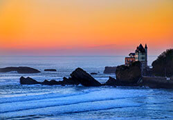 The sky in oranges and pinks from the Cote des Basques beach in Biarritz