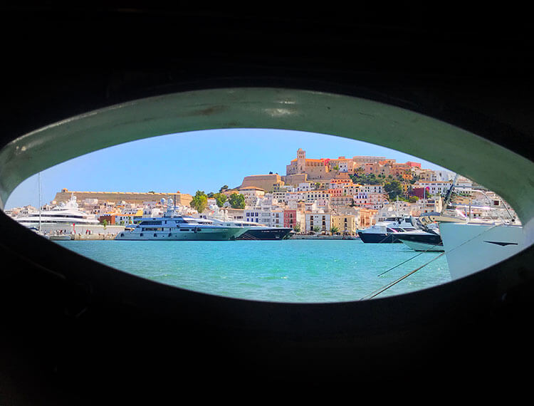 The view of Ibiza Town from our bedroom porthole in the yacht