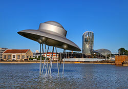 A spaceship sculpture installed in the port in front of La Cité du Vin