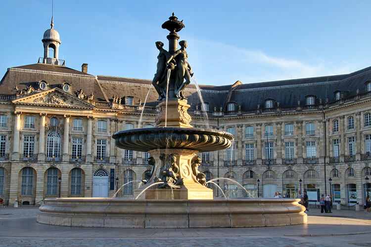 The Fountain of the Three Graces stands in the center of Place de la Bourse 