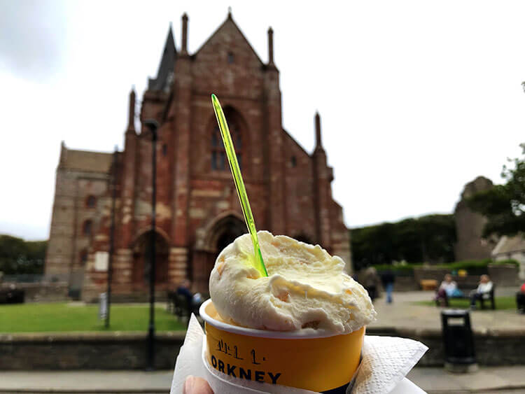 Holding a cup of ice cream in from the St Magnus Cathedral in Kirkwall