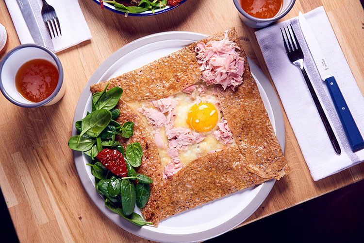 A crepe with white ham, egg, and extra cheese at Candelma
