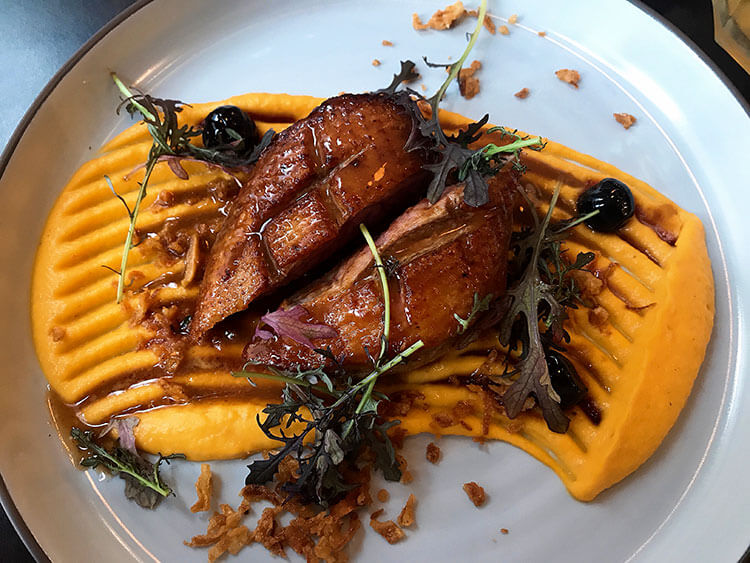 Duck breast on a bed of pumpkin puree at Chez Martin