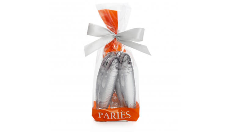 A bag of six chocolate sardines individually wrapped in foil to look like sardines from Maison Paries