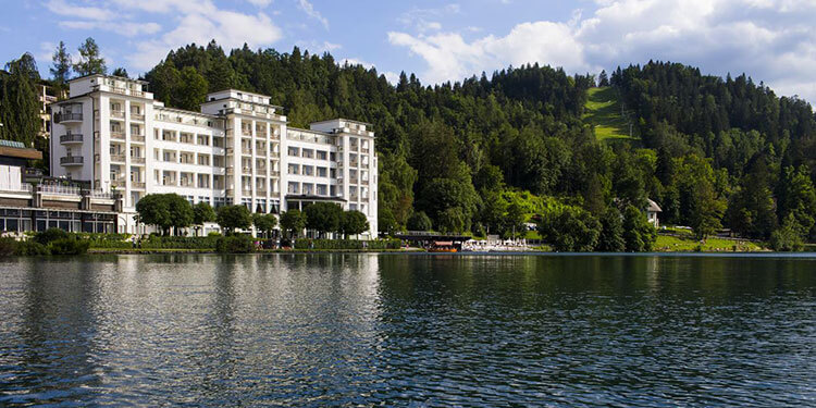 Exterior of Grand Hotel Toplice seen from on Lake Bled