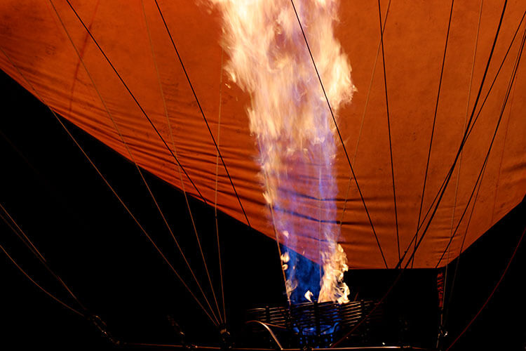 The balloon burner sends up a firey stream to fill the balloon at Governors' Camp Masai Mara