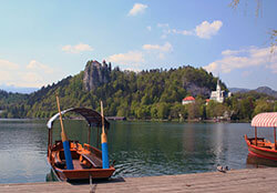 A pletna sits on the shores of Lake Bled