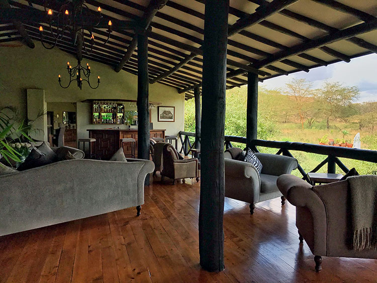 The open air main lodge at The Emakoko with multiple seating areas and a bar