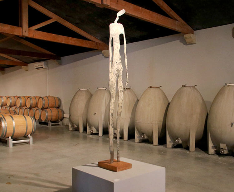The Nomblot eggs line the right wall of the barrel room at Château Marquis de Terme