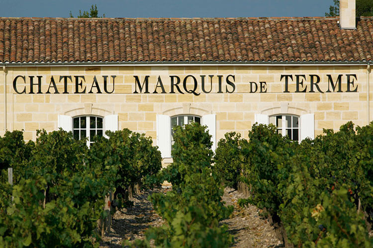 Chateau Marquis de Terme's tasting room seen from in the vineyard