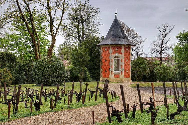 The red brick dovecote still in the gardens at Château Marquis de Terme