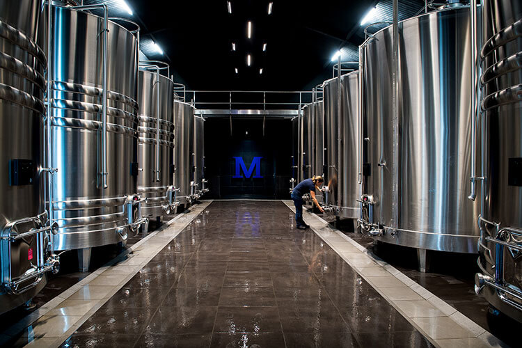 Steel tanks line the modern winery at Château Malescasse