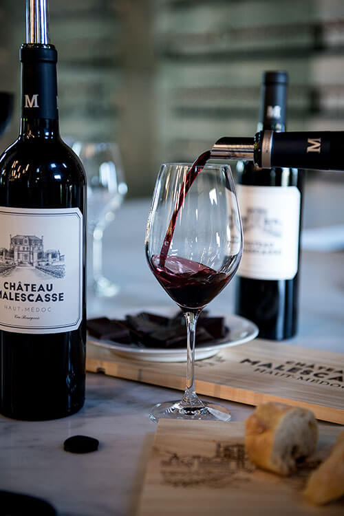 Château Malescasse being poured in to a glass for the tasting in the boutique 