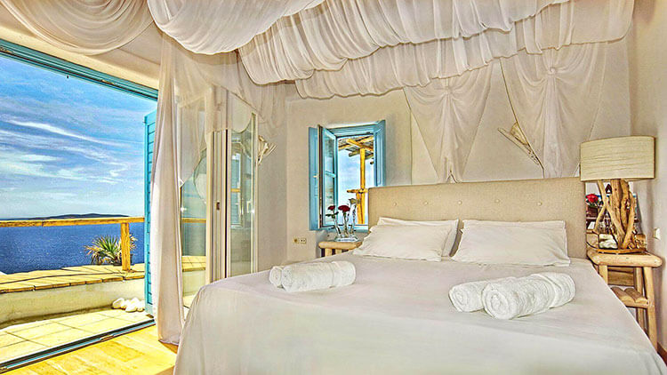 The bedroom is decorated in beach chic at Villa Maristella in Mykonos